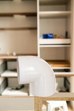 Ventilation elbow joint installation in modern interior under construction Stock-Fotos