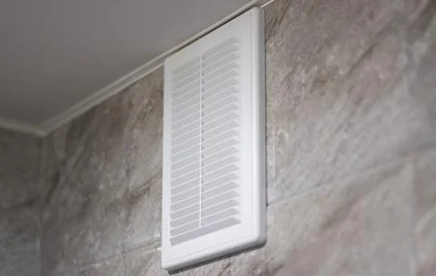 Ventilation grille in white on gray marble tiles Stock Photos