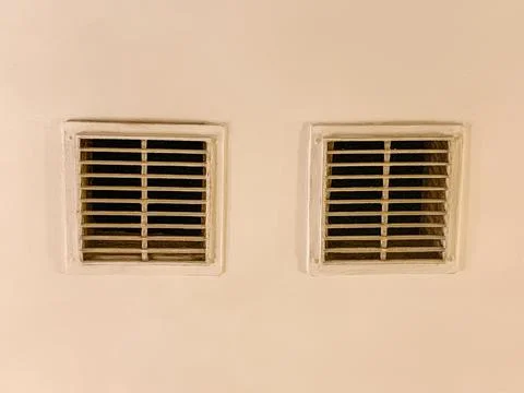 Ventilation grilles on ventilation ducts in the ceiling of the building. shaf Stock Photos
