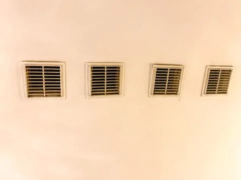 Ventilation grilles on ventilation ducts in the ceiling of the building. shaf Stock Photos