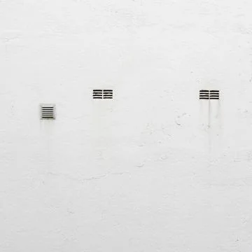 Ventilation grilles on the wall Stock Photos