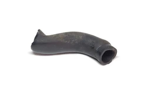 Ventilation hose of car engine crankcase, short and thick, black rubber pip.. Stock Photos