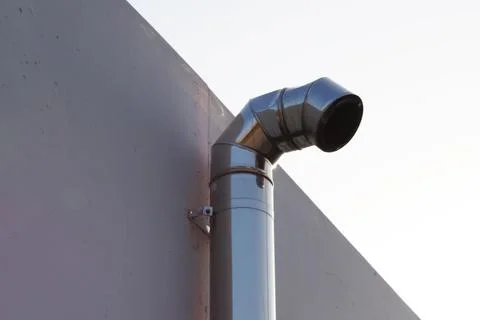 Ventilation pipe on the facade of the house close-up Stock Photos