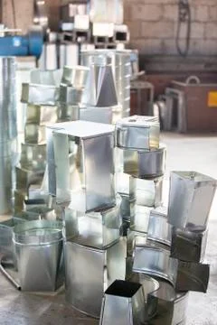 Ventilation pipe factory. Metal processing industry. Blanks for ventilation Stock Photos