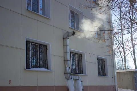 A ventilation pipe from which steam comes out. Stock Photos