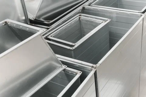 Ventilation rectangular ducts and pipeline parts on store outdoors. Stock Photos