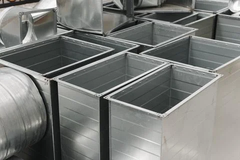 Ventilation rectangular ducts and pipeline parts on store outdoors. Stock Photos