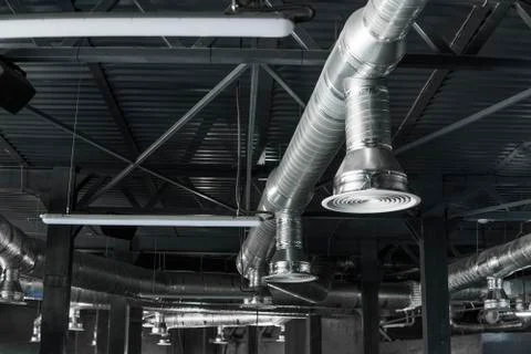 Ventilation system on the ceiling of large buildings. Ventilation pipes in Stock Photos
