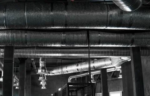 Ventilation system on the ceiling of large buildings. Ventilation pipes in Stock Photos