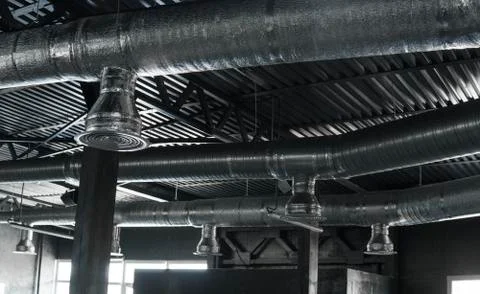 Ventilation system on the ceiling of large buildings. Ventilation pipes in Stock Photos