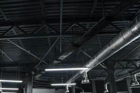 Ventilation system on the ceiling of large buildings. Ventilation pipes in Stock Photos