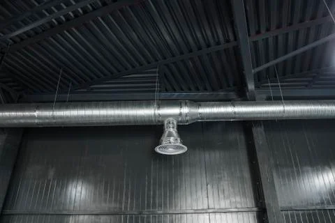 Ventilation system on the ceiling of large buildings. Ventilation pipes in Stock Photos