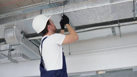 Ventilation system installation and repair service. Hvac technician at work Video stock 239096709