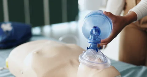 Ventilator, cpr and hands of person with dummy for demonstration, tutorial and Stock Footage 306515342