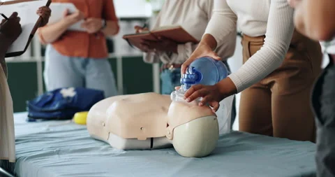 Ventilator, cpr and people with dummy for learning, tutorial or lesson for Stock Footage 306508029