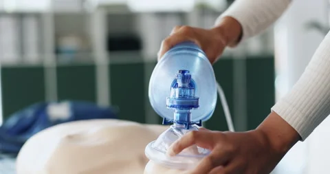 Ventilator, first aid and hands of person with dummy for demonstration, tutorial Stock Footage 306456529