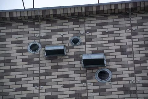 Venting system placed on the brick wall Stock Photos