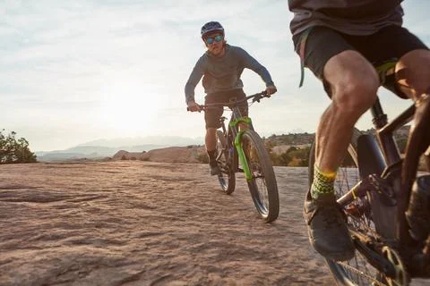 Venture forth into the world. two men out mountain biking together during the Stock Photos