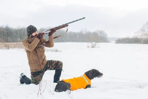 Venturious hunter is going to bring down a bird Stock Photos