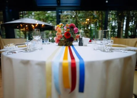 Venue for a wedding reception with decor, selective focus on tables and dec.. Stock Photos