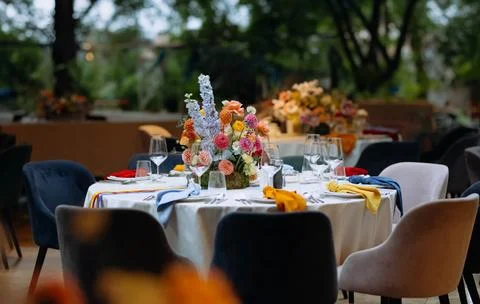 Venue for a wedding reception with decor, selective focus on tables and dec.. Stock Photos