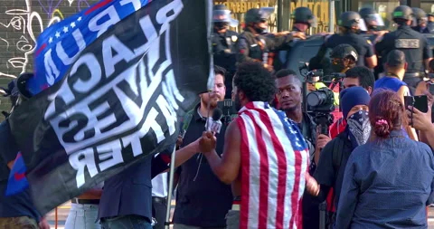 Verbal confrontation between Black Lives Matter and Trump supporters in LA, 4K Video stock 140874874