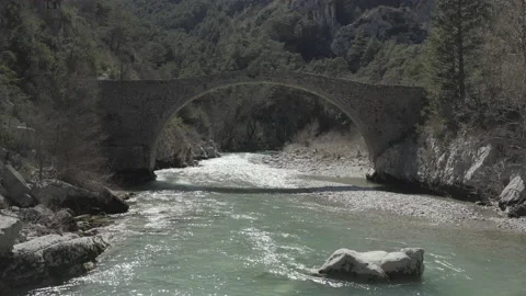 The Verdon river flooding under a stone brige Stock Footage 158677342