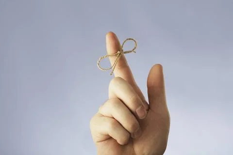 Vergessen Sie nicht... A string tied around an index finger Copyright: xZo... Stock Photos