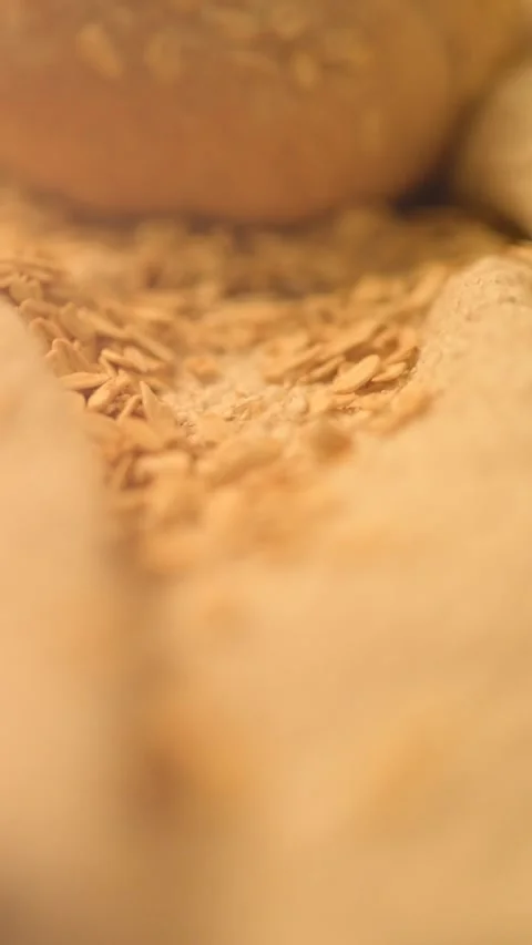 Verical close-up hd slow motion video of homemade bread on a rustic background. Stock Footage 134062614