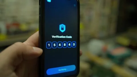 Verification code screen on smartphone with successful authentication close-up. Stockbeeldmateriaal 342735720