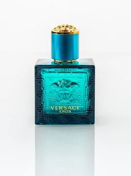 Versace Eros perfume in a rectangular blue glass bottle on a white background. Stock Photos