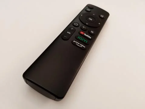 Versatile Black Remote Control with Streaming Buttons Stock Photos