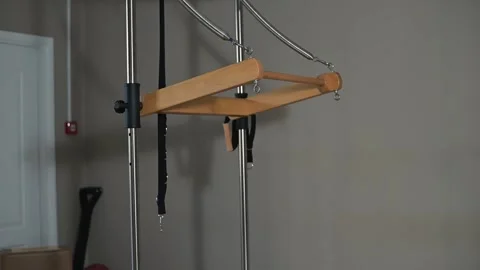 A versatile piece of workout equipment is set up in a home gym environment. The Stockbeeldmateriaal 344374333
