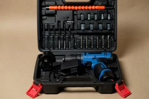 Versatile tool case with cordless drill and home repair essentials Stock Photos
