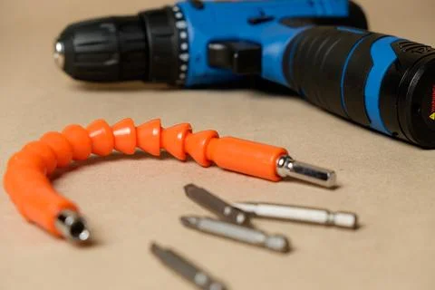 Versatile tool kit featuring a cordless screwdriver and various attachments Stock Photos