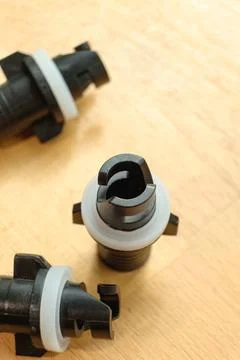 Versatile valve adapter for easy inflation of water sports equipment Stock Photos