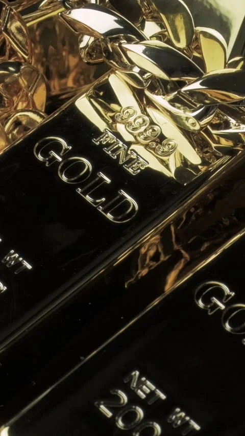 Vertical 1080p Gold Bars and Chain Spinning Wealth Investment Video Concept Stock Footage 335598072
