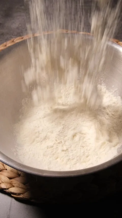 Vertical 1080p Pouring Cake Mix Bowl Stock Footage 332508565