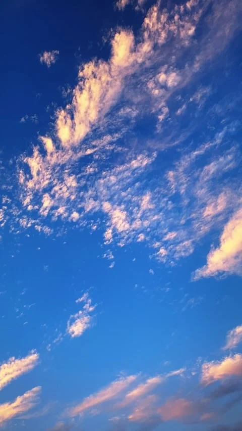 Vertical 1080p Rhythmic Flow of Cloud Layers over Bright Blue Sky Timelapse Video stock 332047210