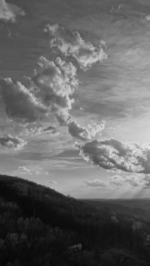 Vertical 2k Cinematic black and white drone hyperlapse of large clouds 動画素材 332885611