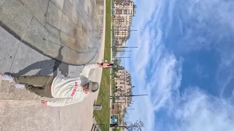 Vertical 360 degrees video of a man in a modern city square in Paris, France Stock Footage 328998701
