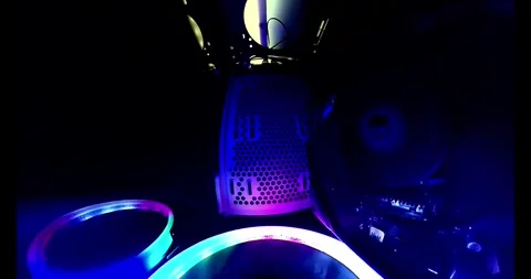 Vertical 360 rotation inside a gaming PC. Close-up of RGB cooler and motherboard Stock Footage 301170112