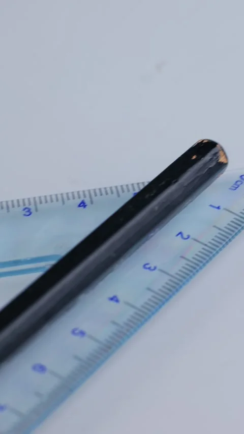 Vertical: 40 degree isosceles right triangle ruler marked in centimeter. Stock Footage 345459645