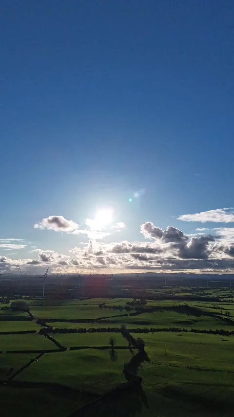 Vertical 4K Aerial View of Sunny Green Countryside Stockbeeldmateriaal 333928039