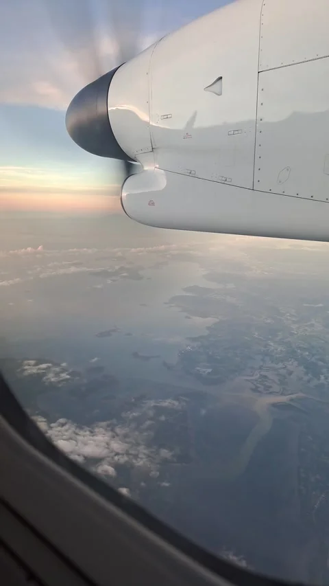 Vertical 4K of airplane window view seat above Cebu Island in the Philippines. Stock Footage 273190017