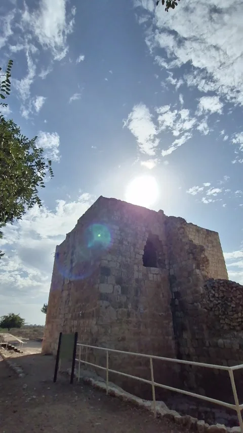 Vertical 4K Cinematic Shot of an Ancient Stone Watchtower in Warm Sunlight Stock Footage 331632743