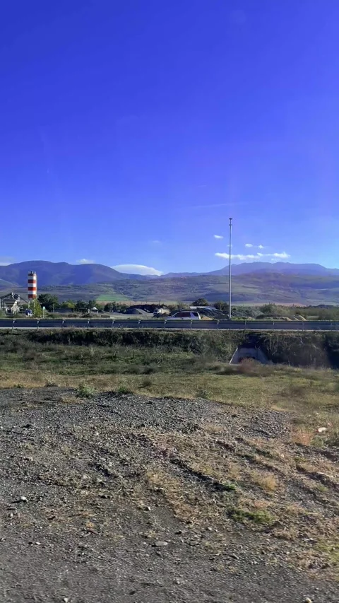 Vertical 4K city video. View from car window. Road to Tbilisi from Borjomi Stock Footage 300686966