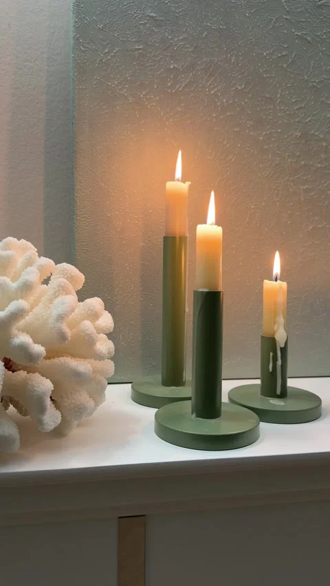 Vertical 4K - Close Up Of Burning Taper Candles And Coral On Fireplace Mantel Stock Footage 345364088