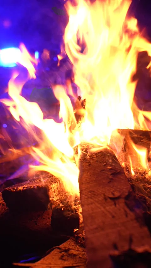 Vertical 4K close up of a campfire with dynamic flames and abundant sparks. Stock Footage 328759167
