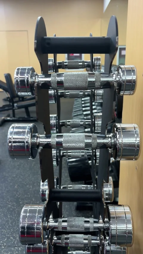 Vertical 4K Close Up of Hand Grabbing 3kg Dumbbell Stock Footage 329336527